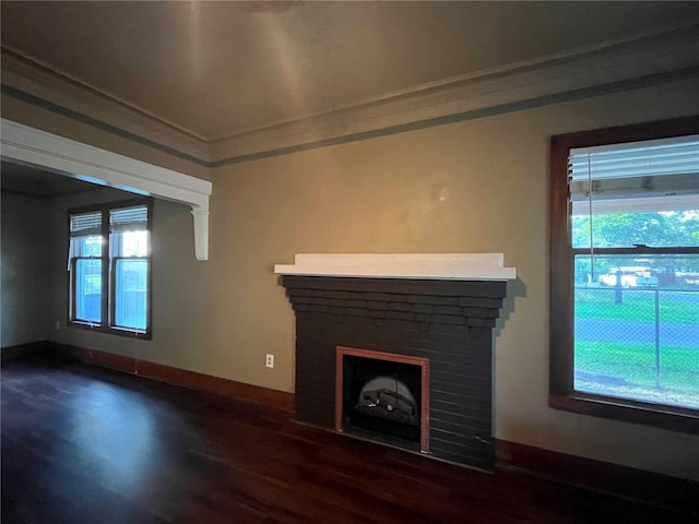 9907 Maggie St, Gibsonton, FL 33534 - unfurnished living room with dark wood-style flooring, ornamental molding, a fireplace, and baseboards