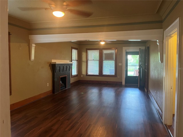 9907 Maggie St, Gibsonton, FL 33534 - unfurnished living room featuring a ceiling fan, ornamental molding, dark wood-style flooring, and a brick fireplace