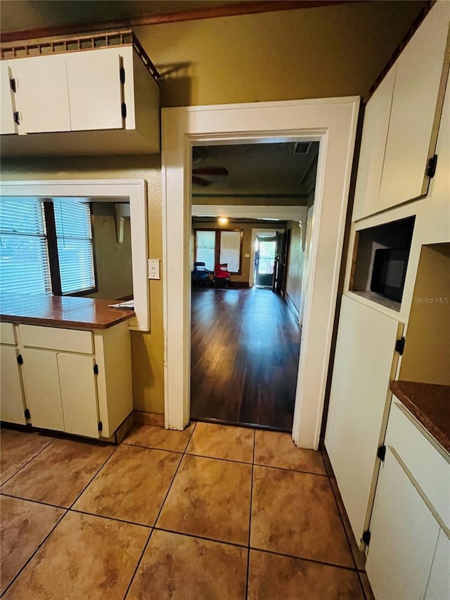 9907 Maggie St, Gibsonton, FL 33534 - hallway with light tile patterned flooring