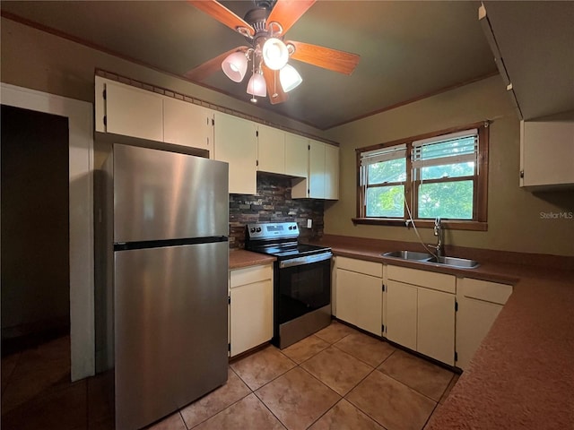 9907 Maggie St, Gibsonton, FL 33534 - kitchen featuring appliances with stainless steel finishes, a sink, ceiling fan, decorative backsplash, and white cabinetry