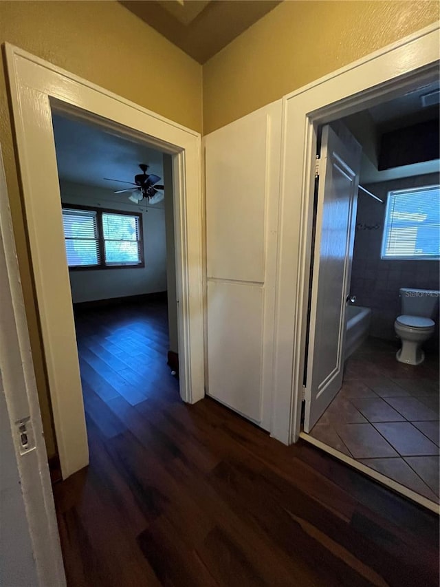 9907 Maggie St, Gibsonton, FL 33534 - corridor featuring dark wood finished floors
