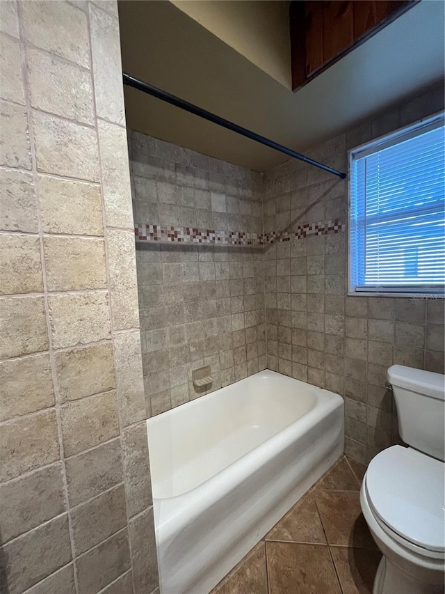 9907 Maggie St, Gibsonton, FL 33534 - bathroom with toilet, tile patterned flooring, and tub / shower combination