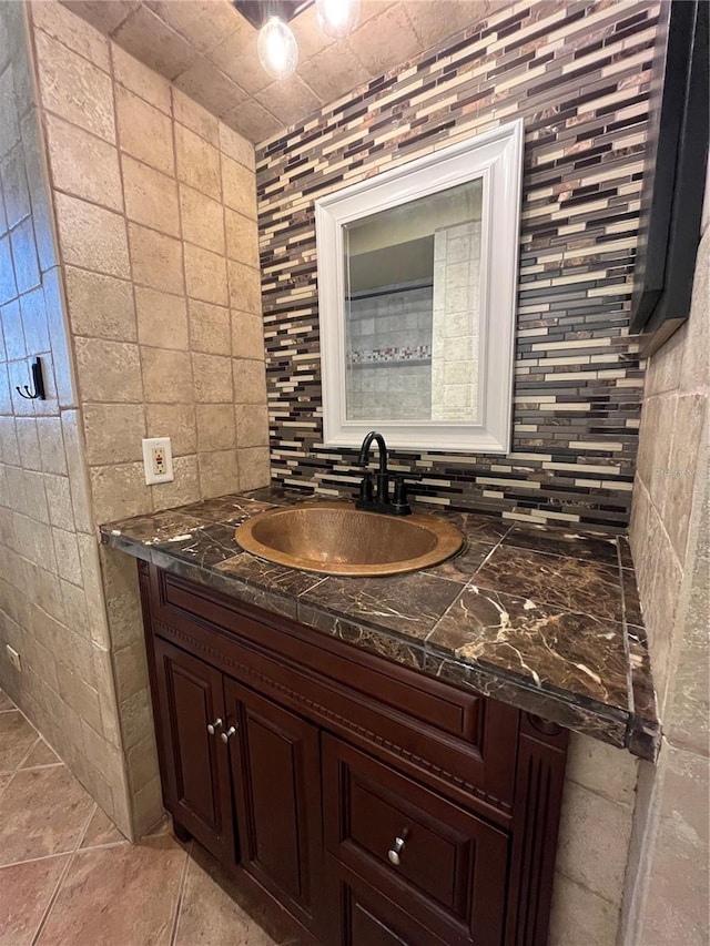 9907 Maggie St, Gibsonton, FL 33534 - bathroom featuring vanity, decorative backsplash, and tile walls