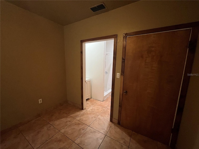 9907 Maggie St, Gibsonton, FL 33534 - empty room with light tile patterned flooring and baseboards