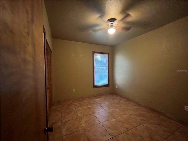 9907 Maggie St, Gibsonton, FL 33534 - unfurnished bedroom featuring light tile patterned floors, a ceiling fan, and a closet