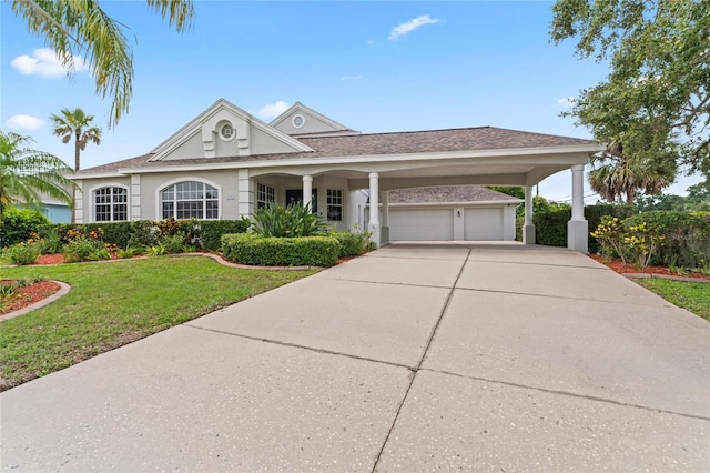 4306 Barracuda Dr, Bradenton, FL 34208 - view of front facade with a front lawn, driveway, an attached garage, and stucco siding