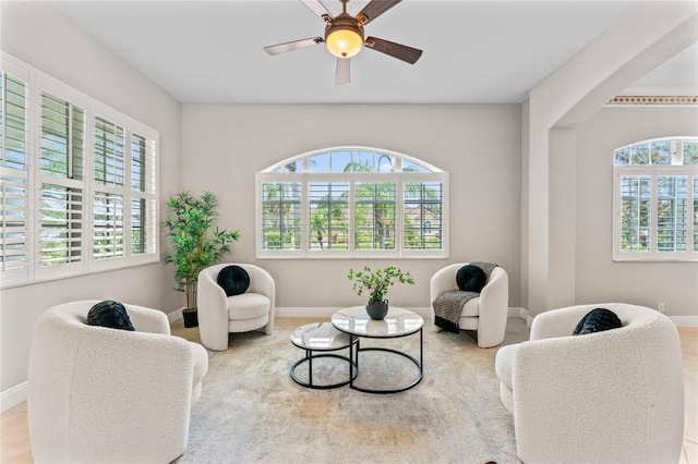 4306 Barracuda Dr, Bradenton, FL 34208 - living area with healthy amount of natural light, baseboards, and ceiling fan