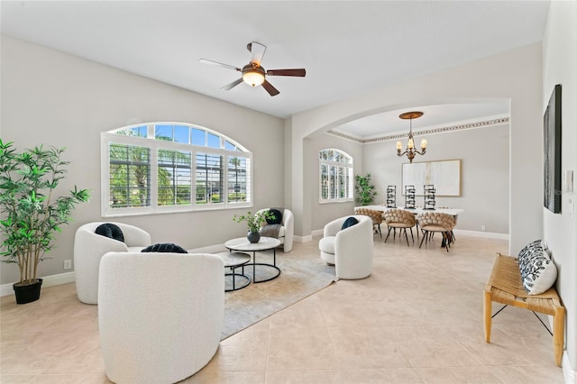 4306 Barracuda Dr, Bradenton, FL 34208 - living room featuring a chandelier, arched walkways, light tile patterned floors, and ceiling fan