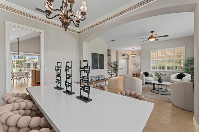 4306 Barracuda Dr, Bradenton, FL 34208 - kitchen featuring open floor plan, arched walkways, a chandelier, ceiling fan, and light tile patterned floors