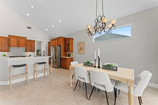 4306 Barracuda Dr, Bradenton, FL 34208 - dining room with a chandelier, high vaulted ceiling, recessed lighting, and light tile patterned floors