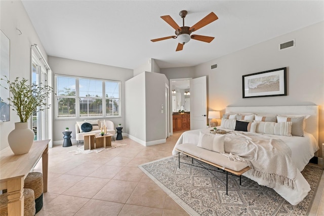 4306 Barracuda Dr, Bradenton, FL 34208 - bedroom with light tile patterned floors, baseboards, connected bathroom, and ceiling fan