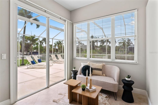 4306 Barracuda Dr, Bradenton, FL 34208 - living area with tile patterned flooring, a sunroom, and baseboards