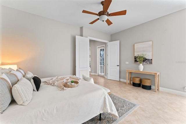 4306 Barracuda Dr, Bradenton, FL 34208 - bedroom with tile patterned flooring, baseboards, and ceiling fan