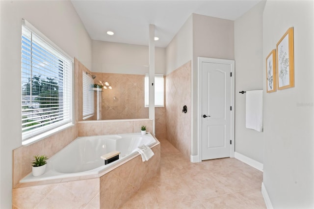 4306 Barracuda Dr, Bradenton, FL 34208 - bathroom featuring plenty of natural light, a garden tub, a walk in shower, and tile patterned flooring