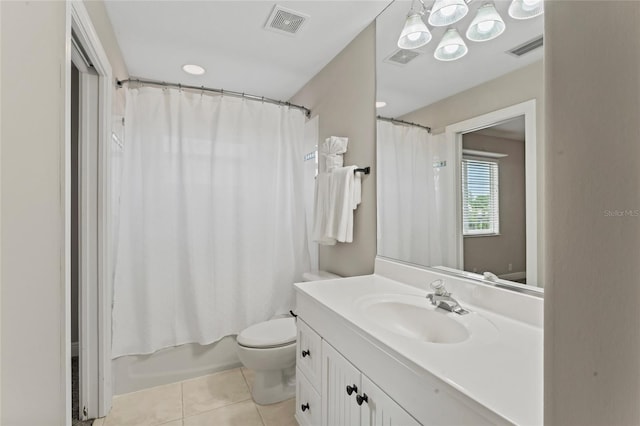 4306 Barracuda Dr, Bradenton, FL 34208 - full bath with tile patterned flooring, toilet, vanity, and shower / bath combo with shower curtain