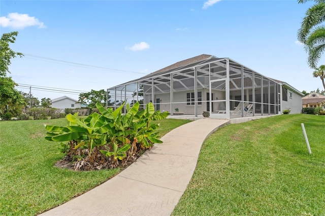 4306 Barracuda Dr, Bradenton, FL 34208 - view of grassy yard featuring glass enclosure