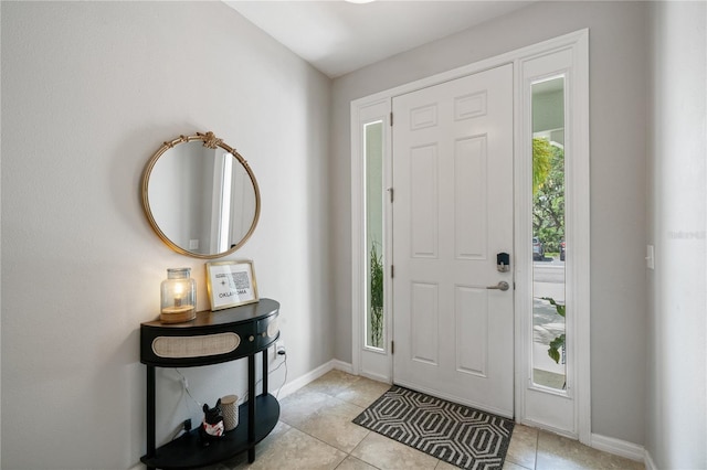 4504 Silver Lining St, Sarasota, FL 34238 - entrance foyer featuring light tile patterned floors and baseboards