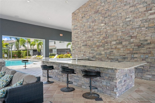 4504 Silver Lining St, Sarasota, FL 34238 - bar area featuring a towering ceiling, recessed lighting, tile patterned floors, and a sink