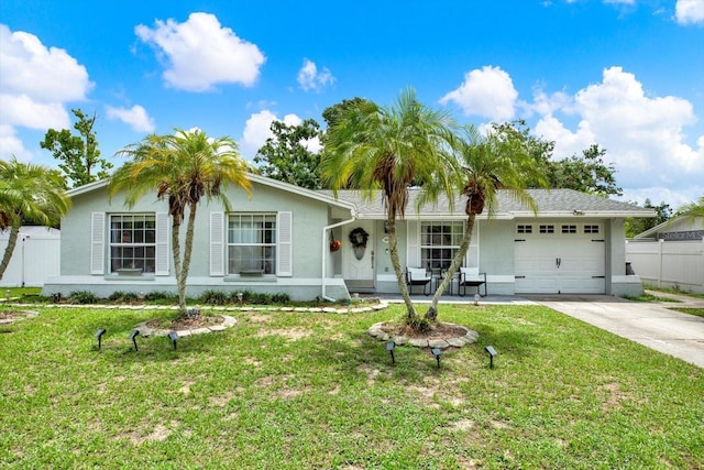 801 Kirkcaldy Way, Valrico, FL 33594 - ranch-style house with an attached garage, concrete driveway, stucco siding, and a porch
