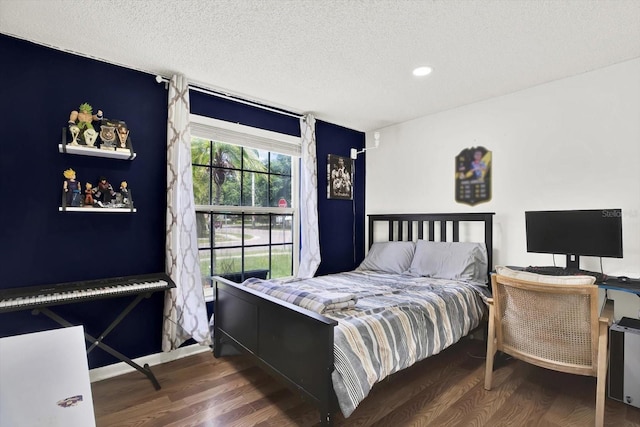 801 Kirkcaldy Way, Valrico, FL 33594 - bedroom featuring wood finished floors, a textured ceiling, recessed lighting, and baseboards