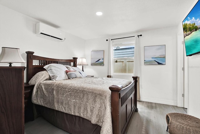 801 Kirkcaldy Way, Valrico, FL 33594 - bedroom with a wall mounted air conditioner, wood finished floors, baseboards, and recessed lighting