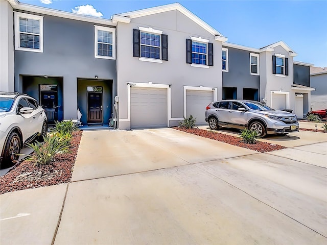 32977 Kaloko Rd, Wesley Chapel, FL 33543 - multi unit property with a garage, driveway, and stucco siding
