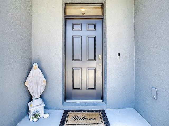 32977 Kaloko Rd, Wesley Chapel, FL 33543 - doorway to property featuring stucco siding