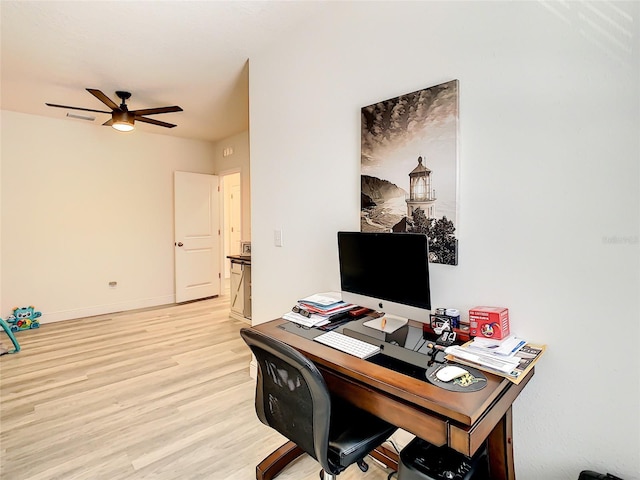 32977 Kaloko Rd, Wesley Chapel, FL 33543 - home office with a ceiling fan and light wood-style floors