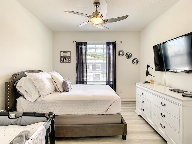 32977 Kaloko Rd, Wesley Chapel, FL 33543 - bedroom with light wood-type flooring and ceiling fan