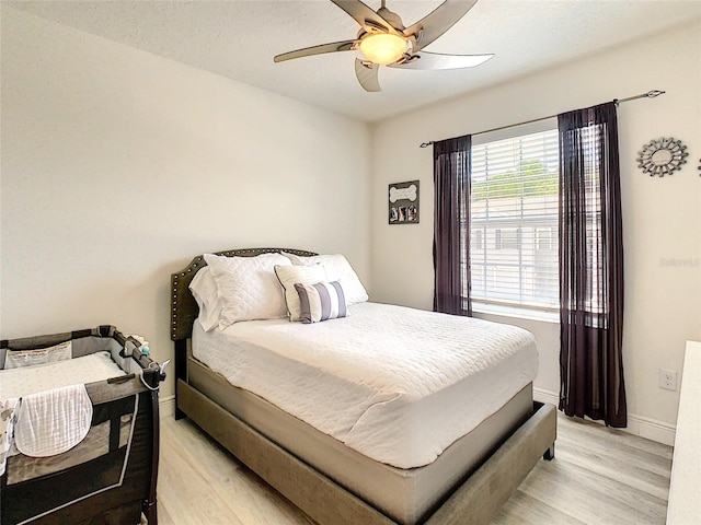 32977 Kaloko Rd, Wesley Chapel, FL 33543 - bedroom with light wood-style floors and ceiling fan