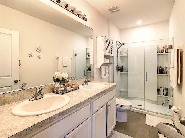 32977 Kaloko Rd, Wesley Chapel, FL 33543 - bathroom with a stall shower, double vanity, and tile patterned floors