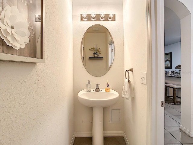 32977 Kaloko Rd, Wesley Chapel, FL 33543 - bathroom with tile patterned flooring and baseboards