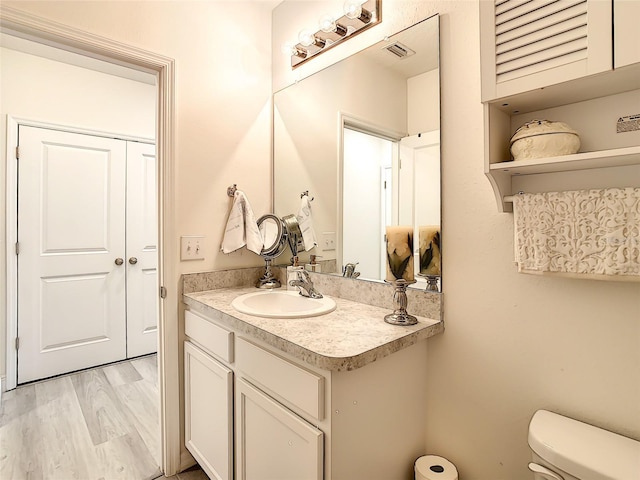32977 Kaloko Rd, Wesley Chapel, FL 33543 - bathroom featuring vanity and wood finished floors