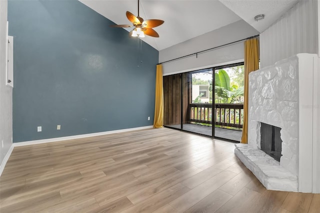 1038 E Michigan St Unit B, Orlando, FL 32806 - unfurnished living room with ceiling fan, high vaulted ceiling, wood finished floors, baseboards, and a fireplace