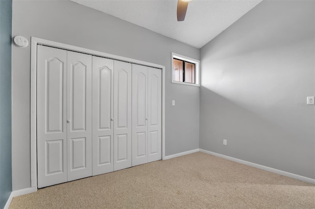 1038 E Michigan St Unit B, Orlando, FL 32806 - unfurnished bedroom with carpet floors, vaulted ceiling, baseboards, a closet, and a ceiling fan