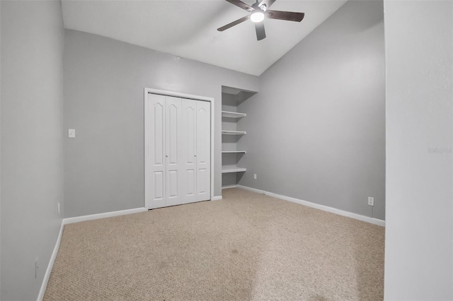 1038 E Michigan St Unit B, Orlando, FL 32806 - unfurnished bedroom featuring carpet flooring, baseboards, a closet, vaulted ceiling, and a ceiling fan