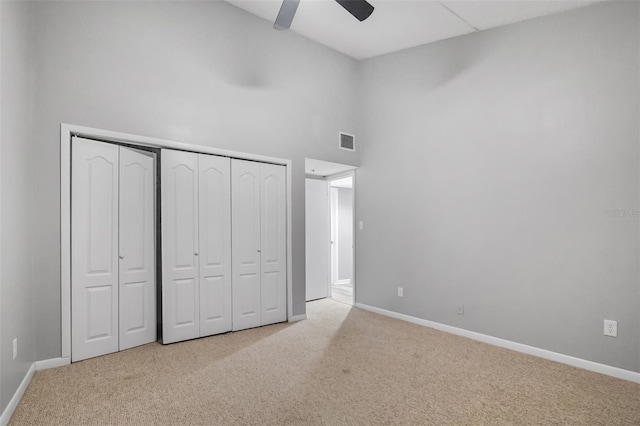 1038 E Michigan St Unit B, Orlando, FL 32806 - unfurnished bedroom featuring a high ceiling, carpet flooring, baseboards, and a closet
