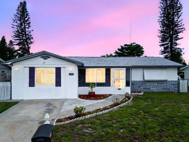 1415 Yale Dr, Holiday, FL 34691 - ranch-style home with stucco siding and a shingled roof