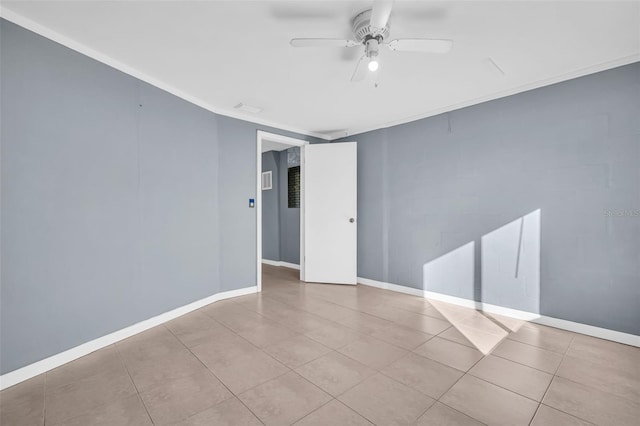 1415 Yale Dr, Holiday, FL 34691 - tiled empty room featuring ceiling fan and baseboards