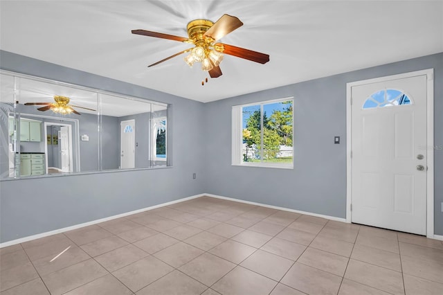 1415 Yale Dr, Holiday, FL 34691 - tiled spare room with ceiling fan and baseboards