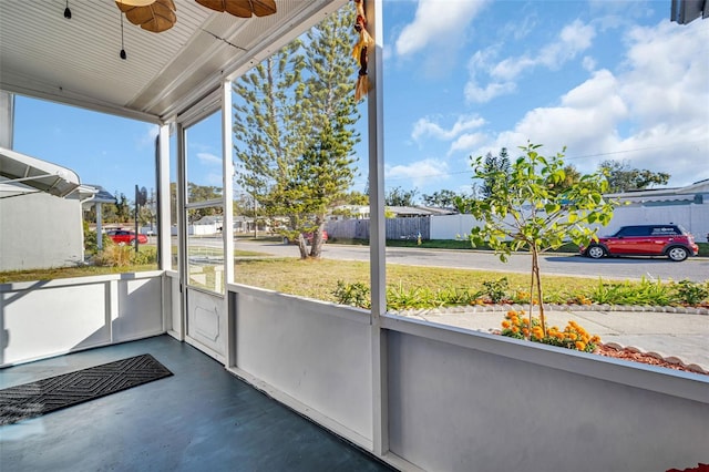 1415 Yale Dr, Holiday, FL 34691 - unfurnished sunroom featuring a ceiling fan