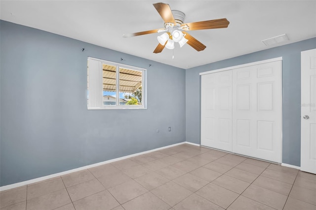1415 Yale Dr, Holiday, FL 34691 - unfurnished bedroom with a closet and ceiling fan