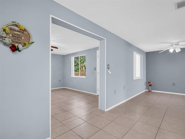 1415 Yale Dr, Holiday, FL 34691 - empty room with a ceiling fan and light tile patterned flooring