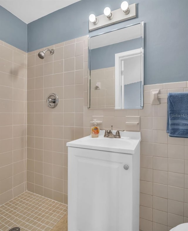 1415 Yale Dr, Holiday, FL 34691 - bathroom with a tile shower, tile walls, and vanity
