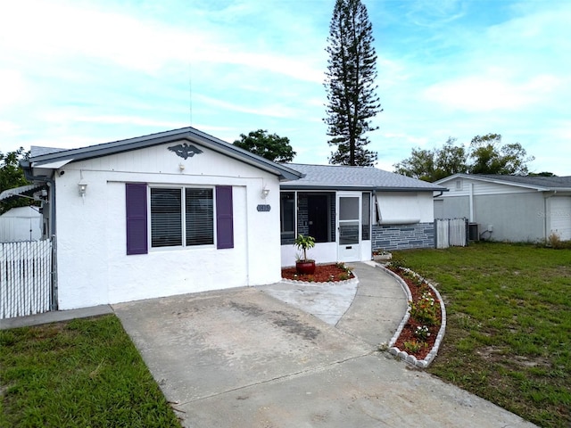 1415 Yale Dr, Holiday, FL 34691 - single story home with a sunroom
