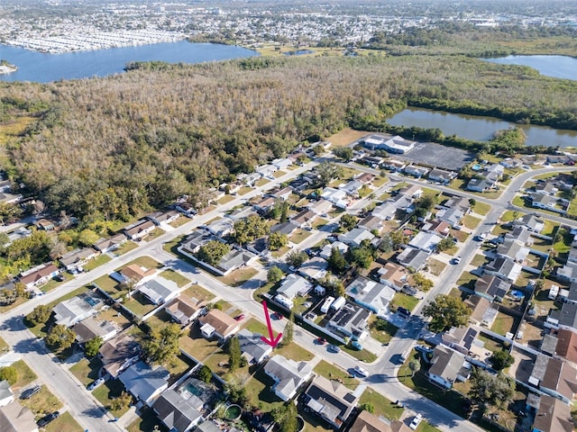 1415 Yale Dr, Holiday, FL 34691 - aerial overview of property's location with a large body of water and a heavily wooded area