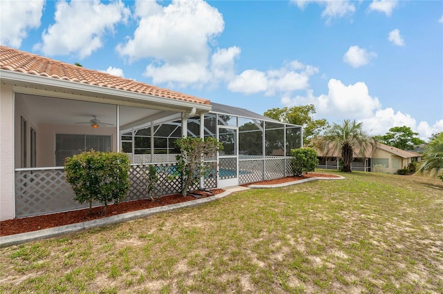11411 Terrell, Spring Hill, FL 34606 - view of green lawn with ceiling fan and glass enclosure