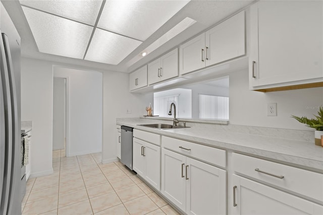 11411 Terrell, Spring Hill, FL 34606 - kitchen featuring a sink, light countertops, appliances with stainless steel finishes, and white cabinetry