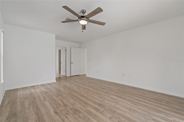 11411 Terrell, Spring Hill, FL 34606 - spare room with light wood-type flooring, ceiling fan, and baseboards