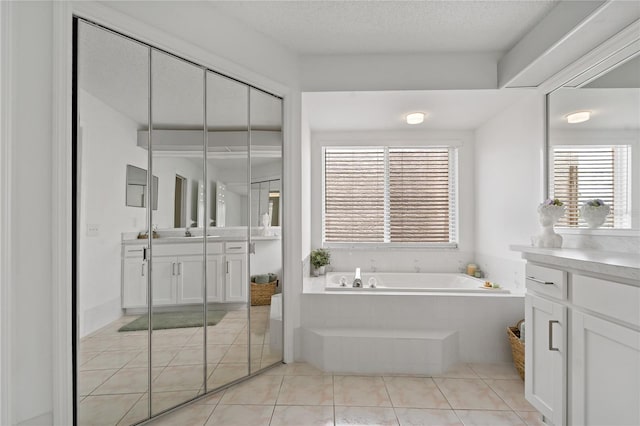 11411 Terrell, Spring Hill, FL 34606 - bathroom with vanity, a garden tub, and tile patterned floors